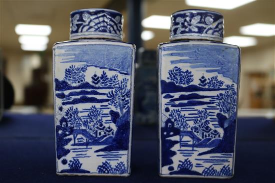 A pair of Dutch delft blue and white lidded tea caddies